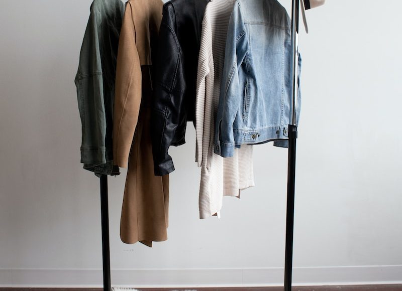five jackets on clothes rack